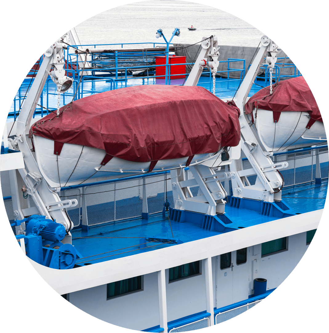 11 Lifeboats with red covers secured on the deck of a ferry, featuring blue and white colors, are ready for emergency use.