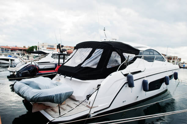 Marine parking of modern motor boats. Luxury yachts docked in sea port.